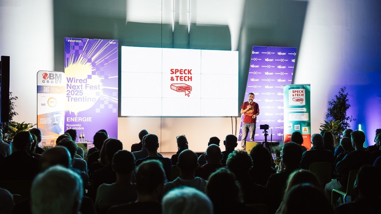 Francesco Bonadiman speaking to a full audience at Wired Next Fest Trentino